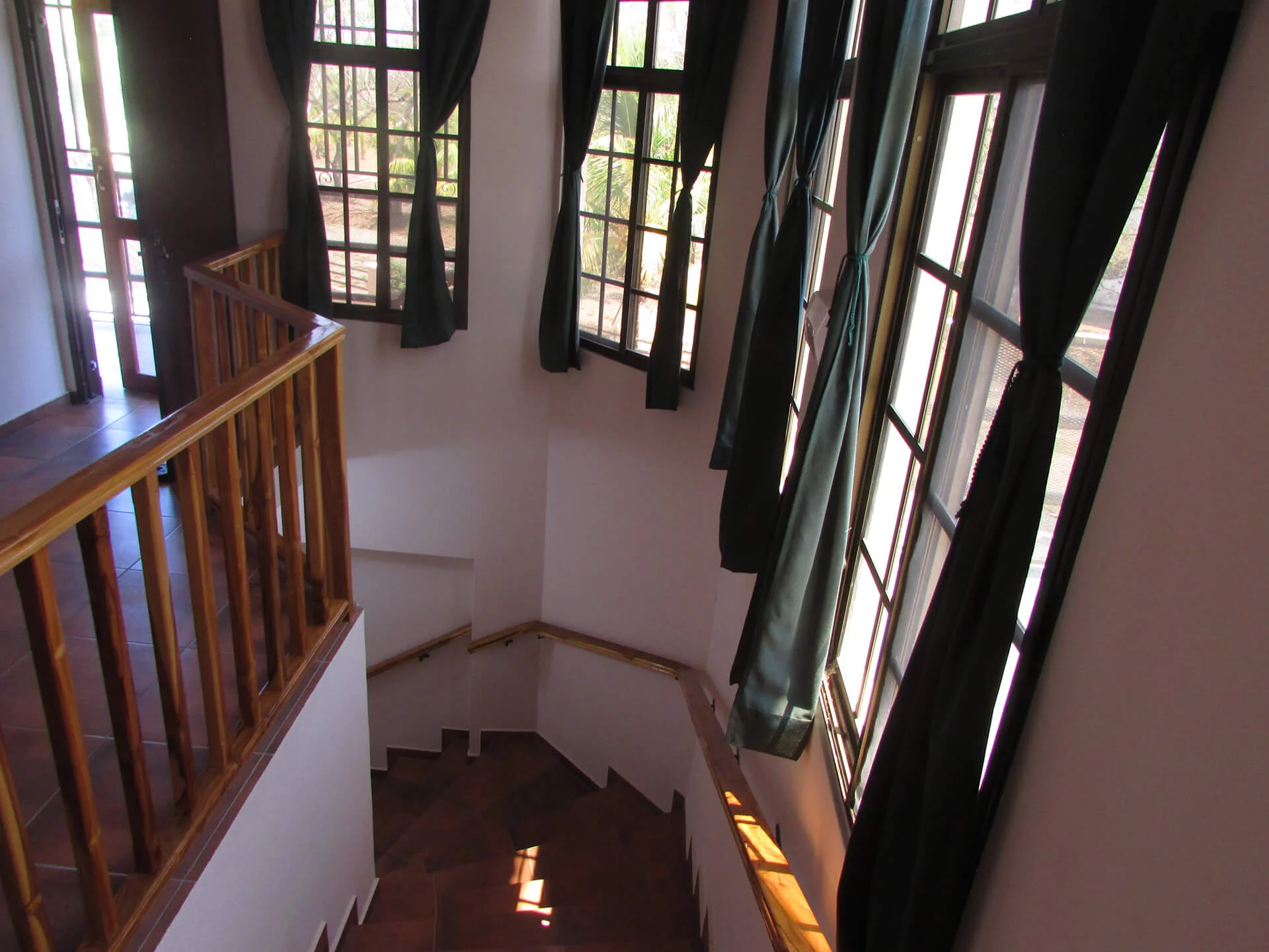 looking down from stairway towards front of house